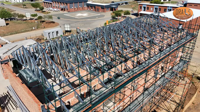 Commercial building roof using ORALS-supplied structural systems and materials