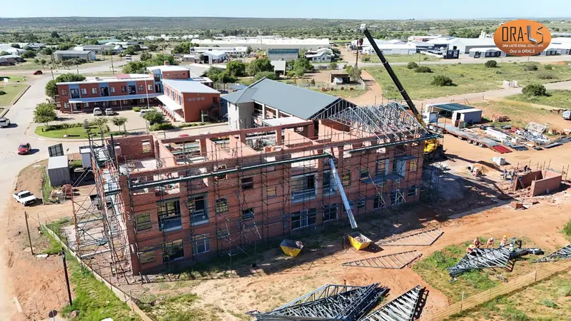Commercial building roof using ORALS-supplied structural systems and materials