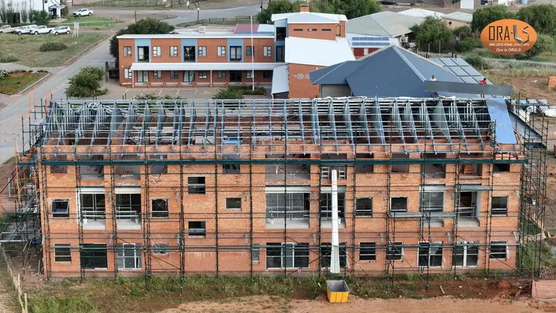 Commercial building roof using ORALS-supplied structural systems and materials