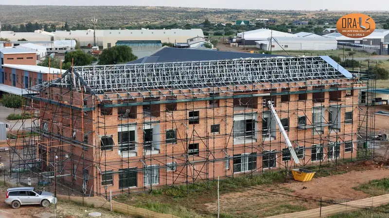Commercial building roof using ORALS-supplied structural systems and materials