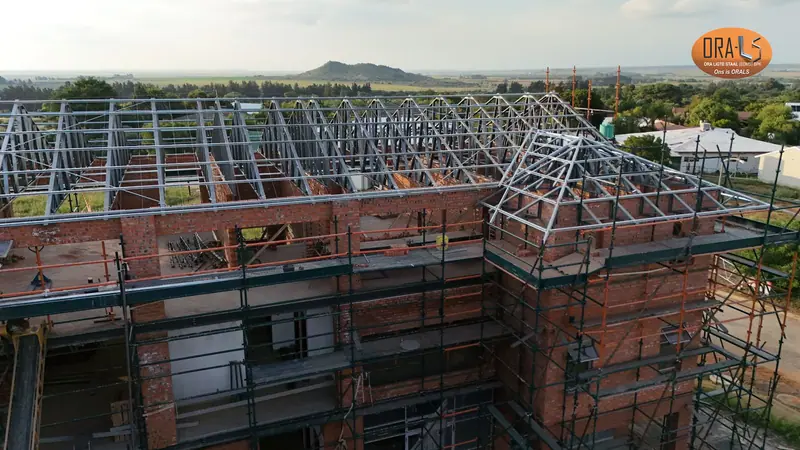 Commercial building roof using ORALS-supplied structural systems and materials