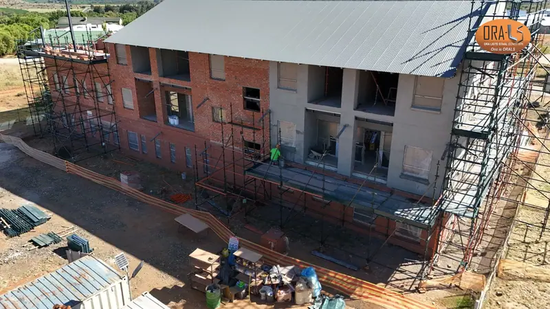 Commercial building roof using ORALS-supplied structural systems and materials
