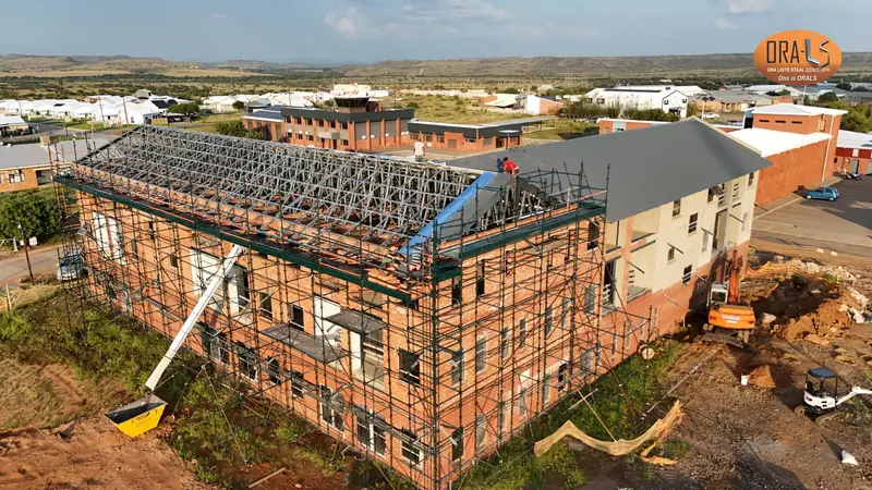 Commercial building roof using ORALS-supplied structural systems and materials