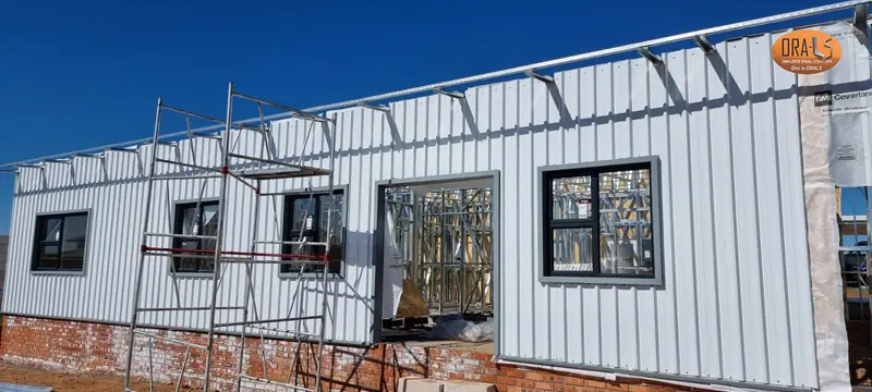 Residential house external cladding using ORALS-supplied structural systems and materials